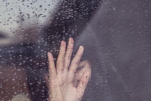 woman crying in rain